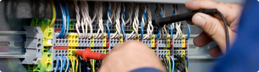 Electrician testing electrical connections