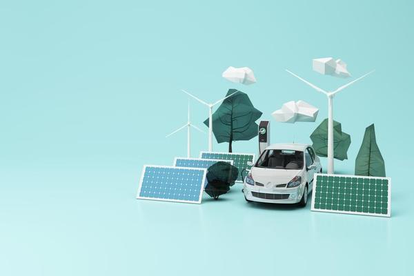 Eco-friendly concept with a silver car, solar panels, wind turbines, and abstract trees and clouds on a light blue background.